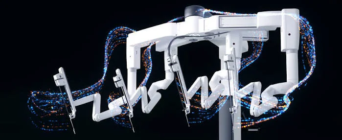 Intuitive Surgical da Vinci 5 console and multi-arm surgical robotic system operating inside a modern sterile surgical suite
