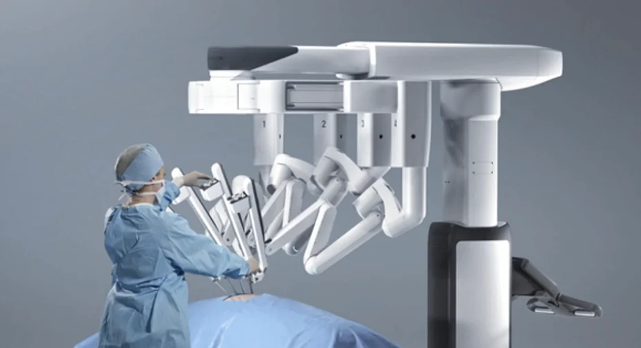 Close-up of robotic surgical end-effectors equipped with force feedback sensors manipulating tissue models
