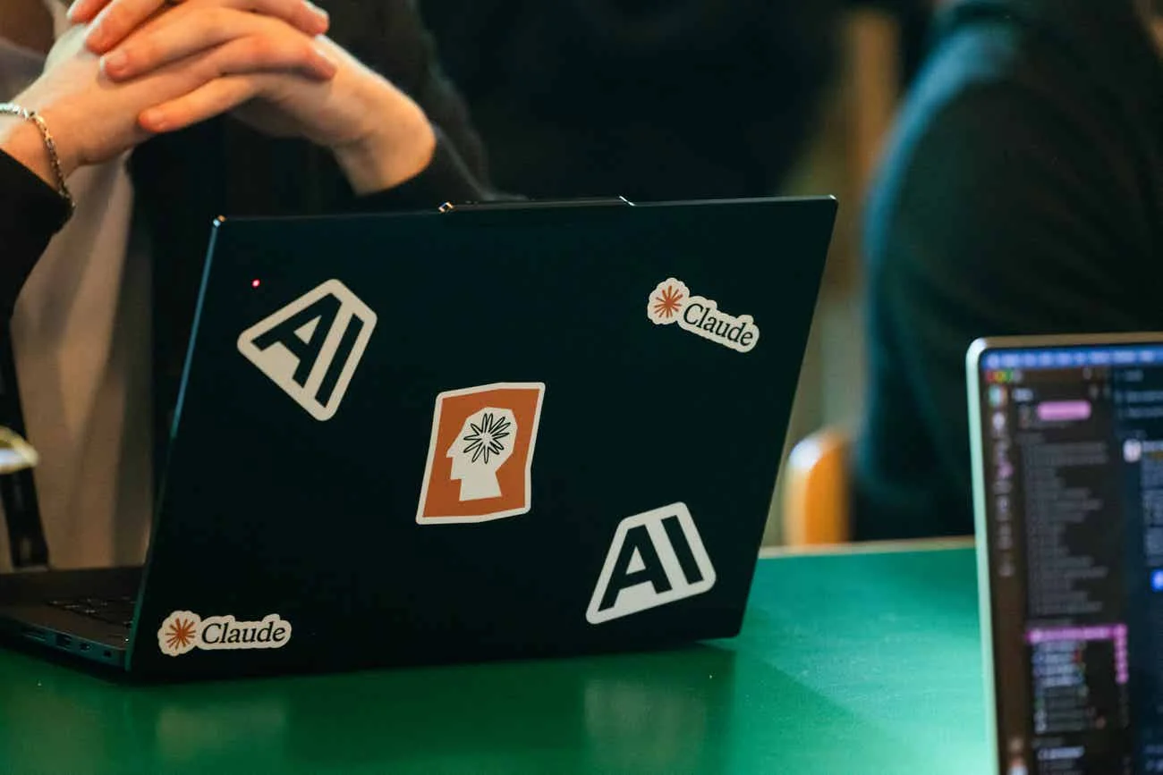 Laptop screen showing the Claude logo next to a keyboard