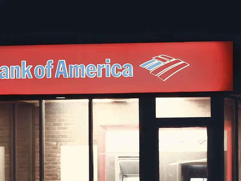 Illuminated Bank of America ATM structure against a dark nighttime backdrop in Boston